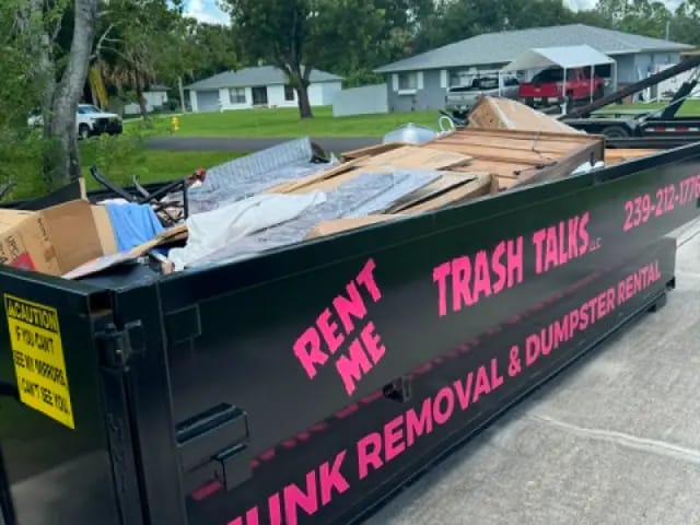 Dumpster filled with construction debris